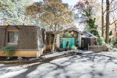 a house with a blue door on a street at Spacious King of Prussia Home with 2 Game Rooms in King of Prussia