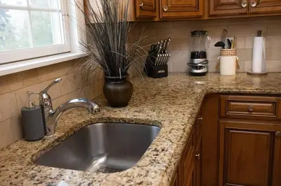 a kitchen counter with a sink and a vase at Family 3-bedroom home (2nd floor near EWR/Outlet) in Elizabeth