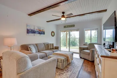 a living room with a couch and a table at Secluded Marathon Hideaway with Fire Pit and Views! in Marathon