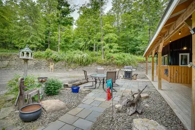 a patio with a table and chairs and a grill at Secluded Marathon Hideaway with Fire Pit and Views! in Marathon