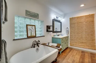 a bath tub in a bathroom with a window at Secluded Marathon Hideaway with Fire Pit and Views! in Marathon