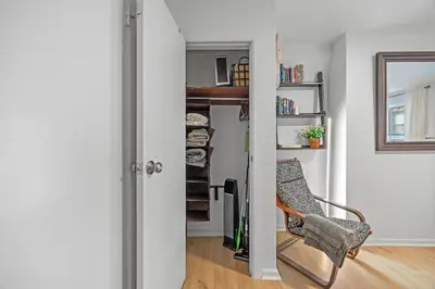 a room with a chair and a book shelf at Times Square Studio near Restaurants & Shopping in New York