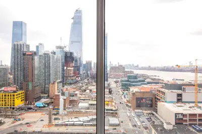 a view of a city from a window at Hells Kitchen 1BR w Pool Gym DM nr Subway NYC-482 in New York
