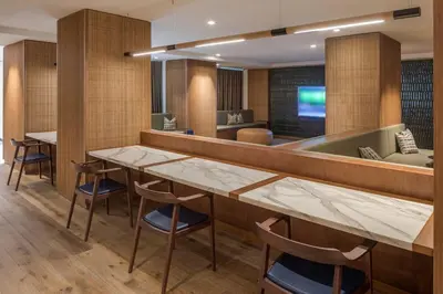 a restaurant with a table and chairs and a tub at Hells Kitchen 1BR w Pool Gym DM nr Subway NYC-482 in New York