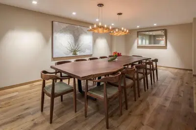 a dining room with a wooden table and chairs at Hells Kitchen 1BR w Pool Gym DM nr Subway NYC-482 in New York