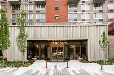 a building with a sign in front of it at Hells Kitchen 1BR w Pool Gym DM nr Subway NYC-482 in New York