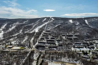an aerial view of a village on a snow covered mountain at Cozy 2BR condo w/ valley views in Vernon Township