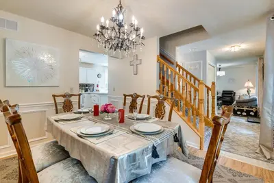 a dining room with a table and a chandelier at Hot Tub, Game Room and Fire Pit Pocono Summit Home! in Pocono Summit