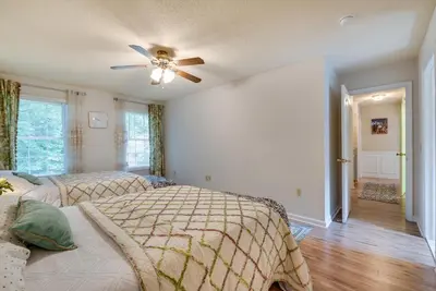 a bedroom with two beds and a ceiling fan at Hot Tub, Game Room and Fire Pit Pocono Summit Home! in Pocono Summit