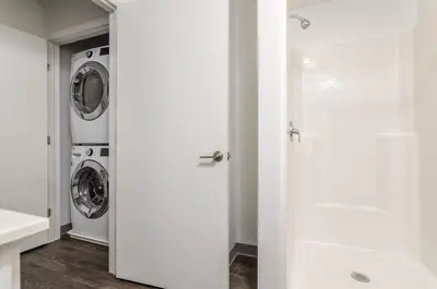a white laundry room with a washer and dryer at Grand Monarch! Best for Extended Stays! in Johnson City