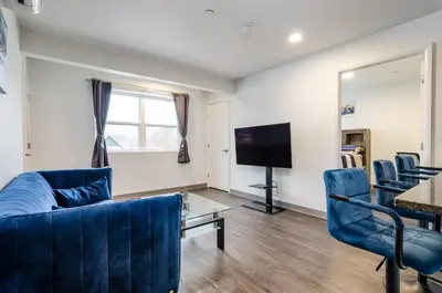 a living room with a couch and chairs and a television at Grand Monarch! Best for Extended Stays! in Johnson City