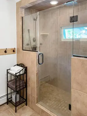a bathroom with a shower with a glass door at Haven Retreat in Catskills w Hot Tub & Bar Hall in Sundown