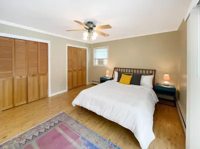 a bedroom with a bed and a ceiling fan at Haven Retreat in Catskills w Hot Tub & Bar Hall in Sundown