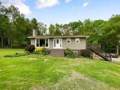 a small house with a porch and a yard at Haven Retreat in Catskills w Hot Tub & Bar Hall in Sundown