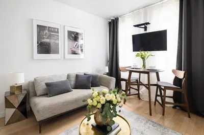 a living room with a couch and a table at Beautiful 2BD with a Gym near Times Square in New York