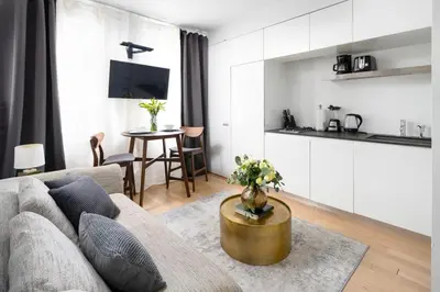 a living room with a couch and a table at Beautiful 2BD with a Gym near Times Square in New York