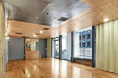 an empty room with a hard wood floor and windows at Stylish 2BD with Washer and Dryer near Times Square in New York