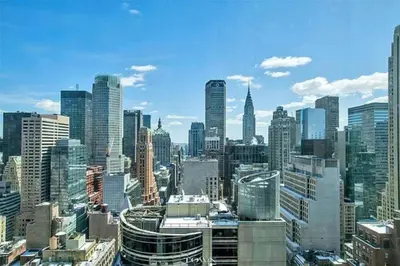 a view of a large city with tall buildings at Perfectly located 2BD near Times Square with Gym in New York
