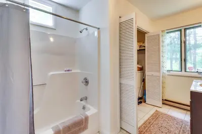 a bathroom with a shower and a bath tub at Fire Pit, Kayaks and Hammocks Long Pond Home! in Long Pond
