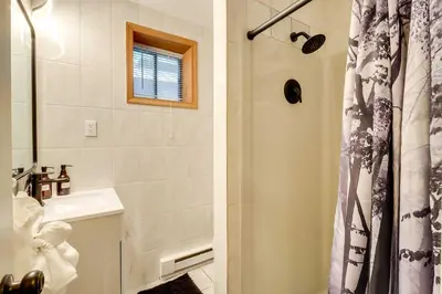a bathroom with a sink and a shower at Game Room and Hot Tub Ski Getaway in Poconos! in East Stroudsburg