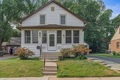 a white house with a front porch and stairs at King Bed Gym Parking AC Train in Narberth