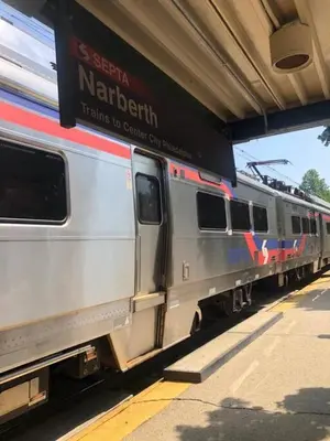 a silver train parked at a train station at 5 Star Penthouse King Deck AC Train in Narberth