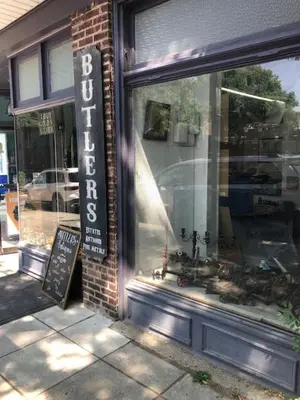a store window with a sign in front of it at 5 Star Penthouse King Deck AC Train in Narberth