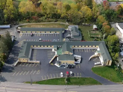 an overhead view of a building with a parking lot at Rodeway Inn Towanda in Towanda
