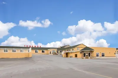 a large parking lot in front of a hotel at Rodeway Inn Towanda in Towanda