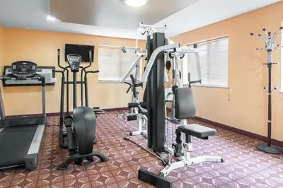 a gym with cardio equipment in a room at Rodeway Inn Towanda in Towanda