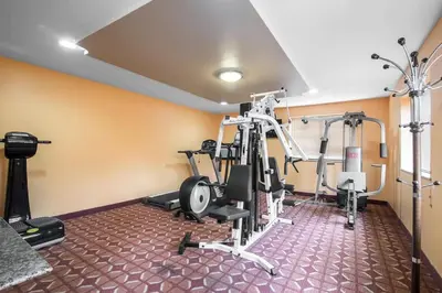 a fitness room with a gym with tread machines at Rodeway Inn Towanda in Towanda