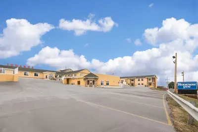 an empty parking lot in front of a building at Rodeway Inn Towanda in Towanda