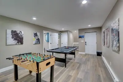 a play room with a foos ball and a table at Cozy Chalet Game Rm and Fireplace in East Stroudsburg