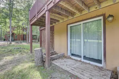 a porch of a house with a large window at Cozy Chalet Game Rm and Fireplace in East Stroudsburg
