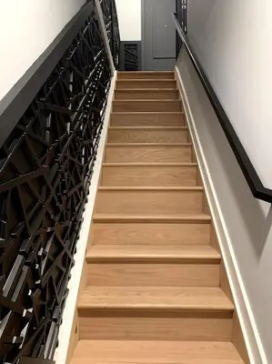 a stairway with wooden steps in a building at Collect3 2BR 1BA Close to Train and NYC in Newark