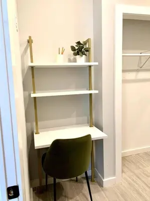 a desk and a chair in a room at Collect3 2BR 1BA Close to Train and NYC in Newark