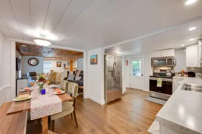 a kitchen and living room with a table and a kitchen and a dining room at Charming Manheim Cottage with On-Site Animal Viewing in Manheim
