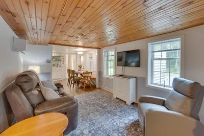 a living room with a couch and a table at Charming Manheim Cottage with On-Site Animal Viewing in Manheim