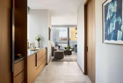 a hallway leading to a room with a living room at Park Hyatt New York in New York