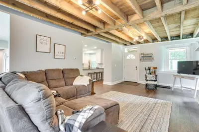 a living room with a couch and a table at Large Historic Home in Pennsylvania Dutch Country! in Coatesville