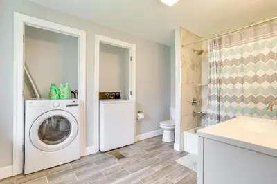 a laundry room with a washer and dryer at Large Historic Home in Pennsylvania Dutch Country! in Coatesville