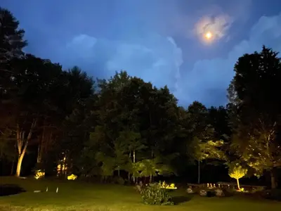 a park at night with the moon in the sky at The Frogtown Inn in Canadensis