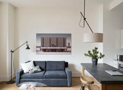 a living room with a couch and a table at ROOST Midtown in Philadelphia