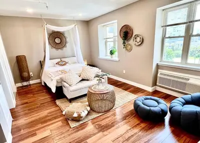 a bedroom with a bed and a couch in a room at 503 Bohemian Romance Apartments in center city in Philadelphia