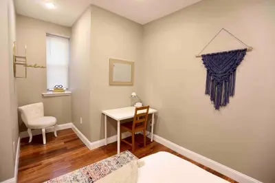 a room with a desk and a table and a chair at 504 Luxe 1BDR APT in center city in Philadelphia