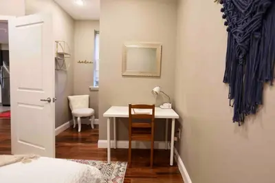 a bedroom with a desk and a table with a chair at 504 Luxe 1BDR APT in center city in Philadelphia