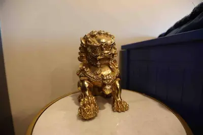 a gold lion statue sitting on top of a table at 504 Luxe 1BDR APT in center city in Philadelphia