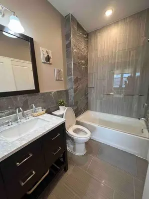 a bathroom with a tub and a toilet and a sink at 502 Luxury 1BR apartment in center city in Philadelphia