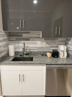 a kitchen with a sink and a counter top at 502 Luxury 1BR apartment in center city in Philadelphia