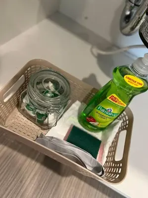 a drawer with a bottle of detergent and a pair of scissors at 502 Luxury 1BR apartment in center city in Philadelphia